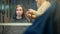 Beautiful woman with long hair doing professional evening hairdress in a beauty salon