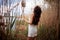 Beautiful Woman With Long Hair In Dress Near The Lake In The Reeds