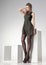 Beautiful woman with long legs in leather dress posing in the studio - full body