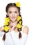 Beautiful woman with long pigtails and yellow flowers