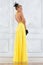 Beautiful woman in a long yellow dress.