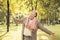 Beautiful  woman looking at autumn sunlight outdoors. Romantic girl in fall park