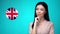 Beautiful woman looking at Great Britain flag sign, international relationships