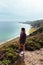 Beautiful woman looking at seascape in Brittany