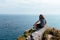 Beautiful woman looking at seascape in Brittany