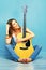 Beautiful woman music portrait with guitar