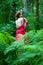 Beautiful woman with naked back In summer forest