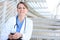 Beautiful Woman Nurse at Hospital on Stairs