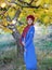 Beautiful woman outdoor portrait, dressed in knitted beret and blue cardigan