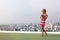 Beautiful woman photographer on the roof top