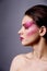 Beautiful woman with pink make up profile shot