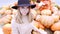 Beautiful woman portrait wearing hat at the autumn fair