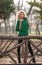 Beautiful woman posing in park during autumn season. Blonde girl wearing green blouse posing outdoor. Long fair hair girl