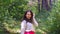 Beautiful woman posing in the woods on a sunny autumn day