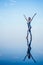 Beautiful woman practice yoga pose on the infinity pool above the mountain peak in the morning in front of beautiful