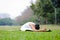 Beautiful woman practicing yoga in the park