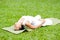 Beautiful woman practicing yoga in the park