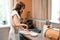 Beautiful woman preparing bacon for tasty omelet on kitchen