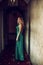 Beautiful woman princess wearing long green dress