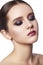 Beautiful Woman with Professional Makeup. Celebrate Style Eye Make-up, Perfect Eyebrows, Shine Skin. Bright Fashion Look