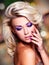 Beautiful woman with purple nails and glamour makeup