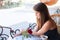 Beautiful woman reading a newspaper in the cafe