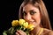 Beautiful woman recieving yellow rose flowers