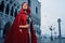 Beautiful woman in red cloak