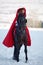 Beautiful woman with red cloak with horse outdoor