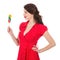 Beautiful woman in red dress with colorful lollipop