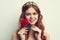 beautiful woman with red hair red rose flower close up