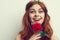 beautiful woman with red hair red rose flower close up