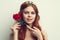 beautiful woman with red hair red rose flower close up