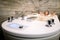 Beautiful woman relaxing in the bathtub having a hydromassage therapy. Focus on the bath