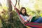 Beautiful woman resting on a hammock