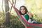 Beautiful woman resting on a hammock