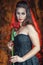 Beautiful woman with rose in halloween style