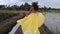 Beautiful woman is running in paddy fields at morning