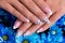 Beautiful woman\'s nails with french manicure