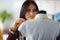 Beautiful woman seamstress, measures mannequin