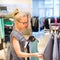 Beautiful woman shopping in clothing store.