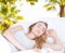 Beautiful woman sleeping on blurred tropical background,good dream,creative concept