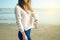 Beautiful woman smiling sweater jeans watch