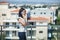 Beautiful woman speaking on mobile phone on rooftop