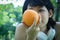 Beautiful woman sport holding orange fruits for healthy food concept