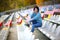 Beautiful woman in the stadium. Portrait of a fitness woman resting at outdoor stadium