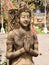 Beautiful woman stone statue at the entrance of a buddhist temple.