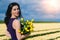 Beautiful Woman in summer dres standing in colorful tulip flower fields in Amsterdam region, Holland, Netherlands