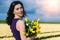 Beautiful Woman in summer dres standing in colorful tulip flower fields in Amsterdam region, Holland, Netherlands