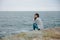 beautiful woman sweaters cloudy sea admiring nature female relaxing